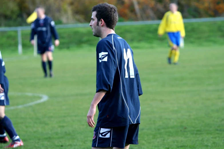 there are many male soccer players playing on the field