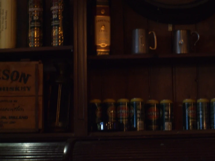 a shelf with some beer cans in a room