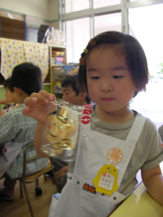 young child getting ready to make a sandwich