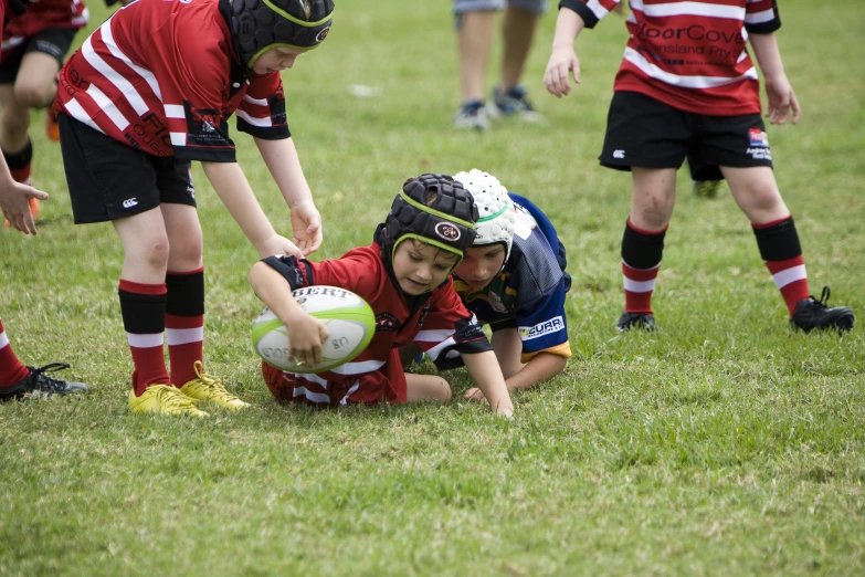 children in the middle of a game of rugby