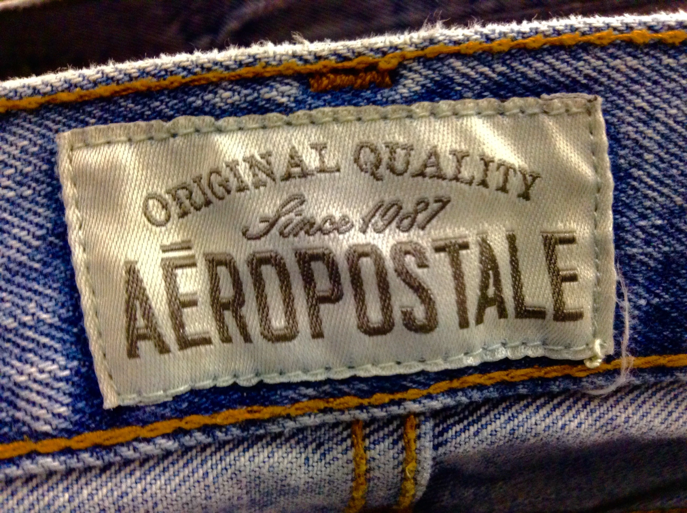 a label on an old jeans pants