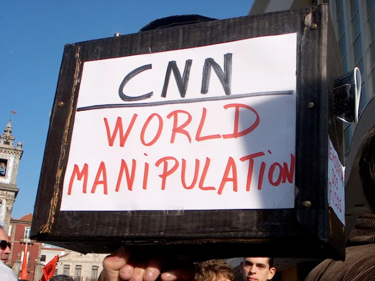 several people with signs protesting against climate change