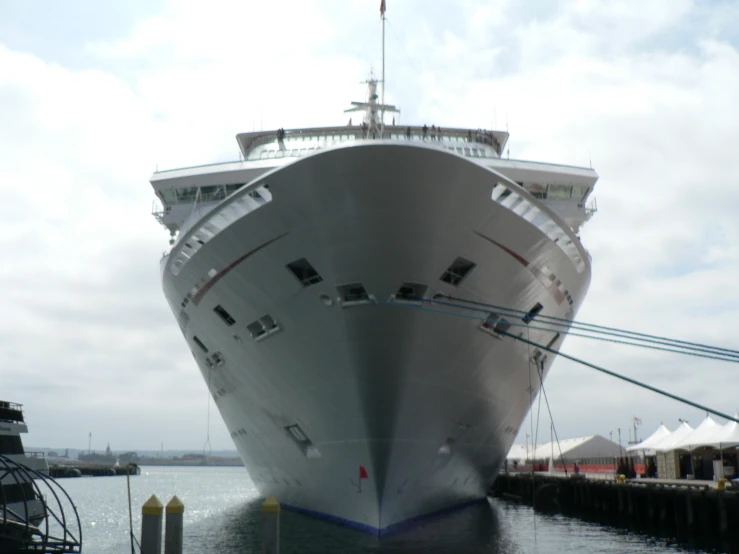 a large ship tied up to the docks