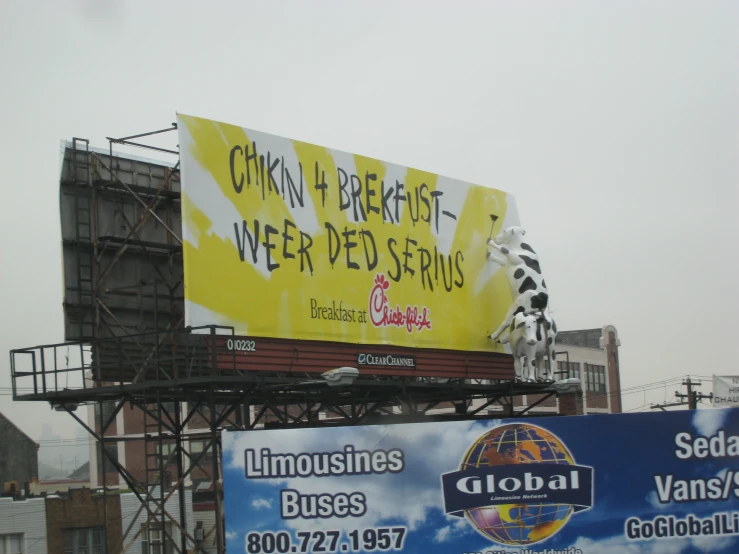an advertit billboard sitting on top of a building