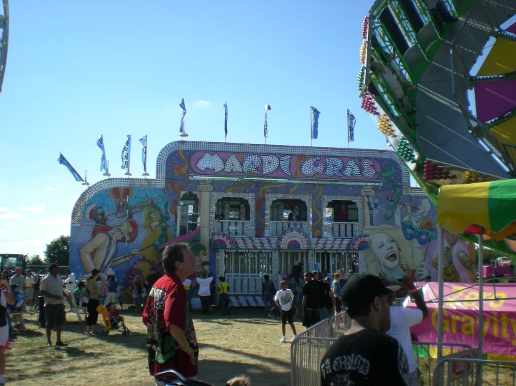 a carnival where a few children are riding horses
