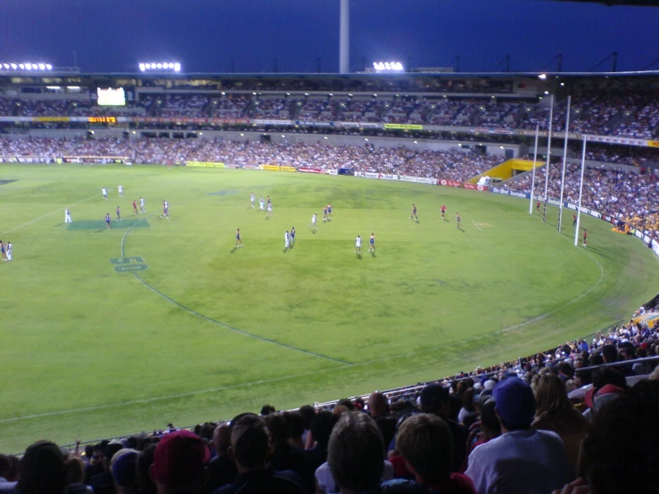 the spectators are watching the men's soccer game