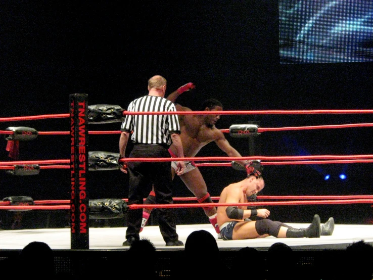 the referee is showing the man what to do during a match