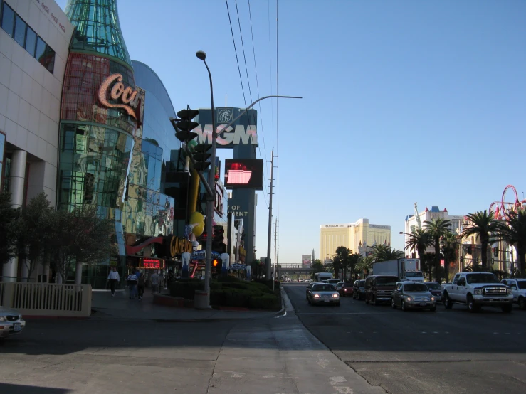 the city street is busy with cars and pedestrians