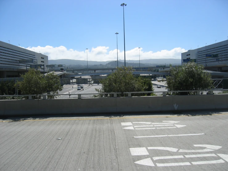 some sort of airport building with a lot of space around it