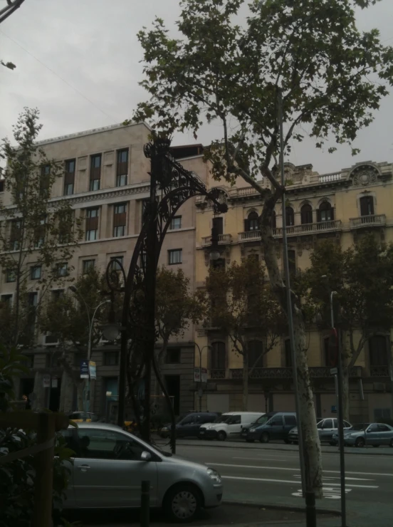 a very tall building with a parking lot underneath it