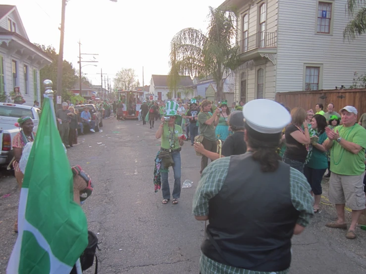 a group of people walking on a street