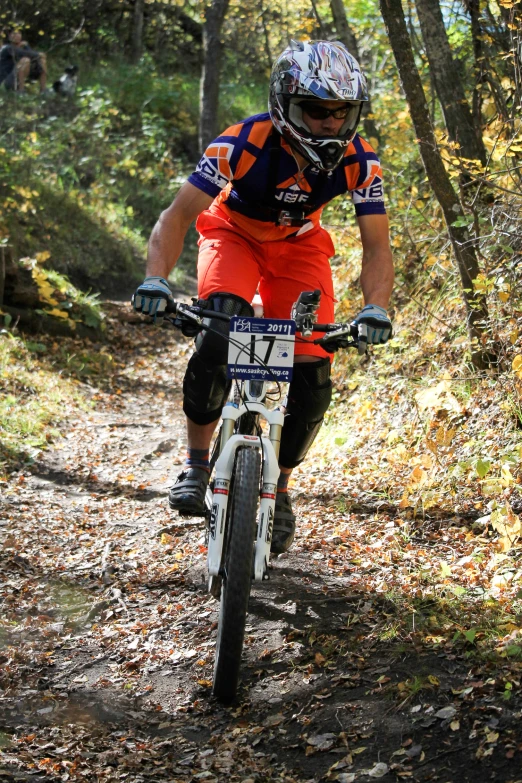 a mountain biker is riding through the woods on a trail