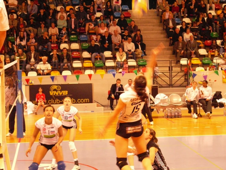 the women are competing on a indoor court