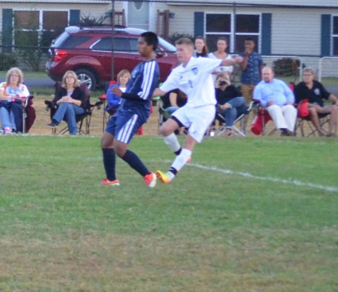 there are many children playing soccer in the field