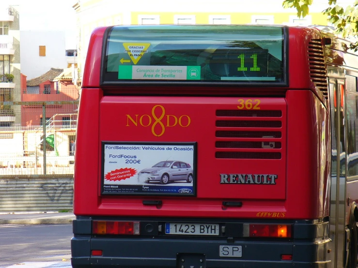 the back end of a red bus with noosa written on it