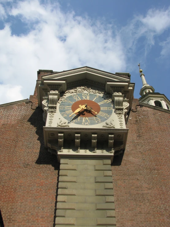 a very large clock that is on the side of a building