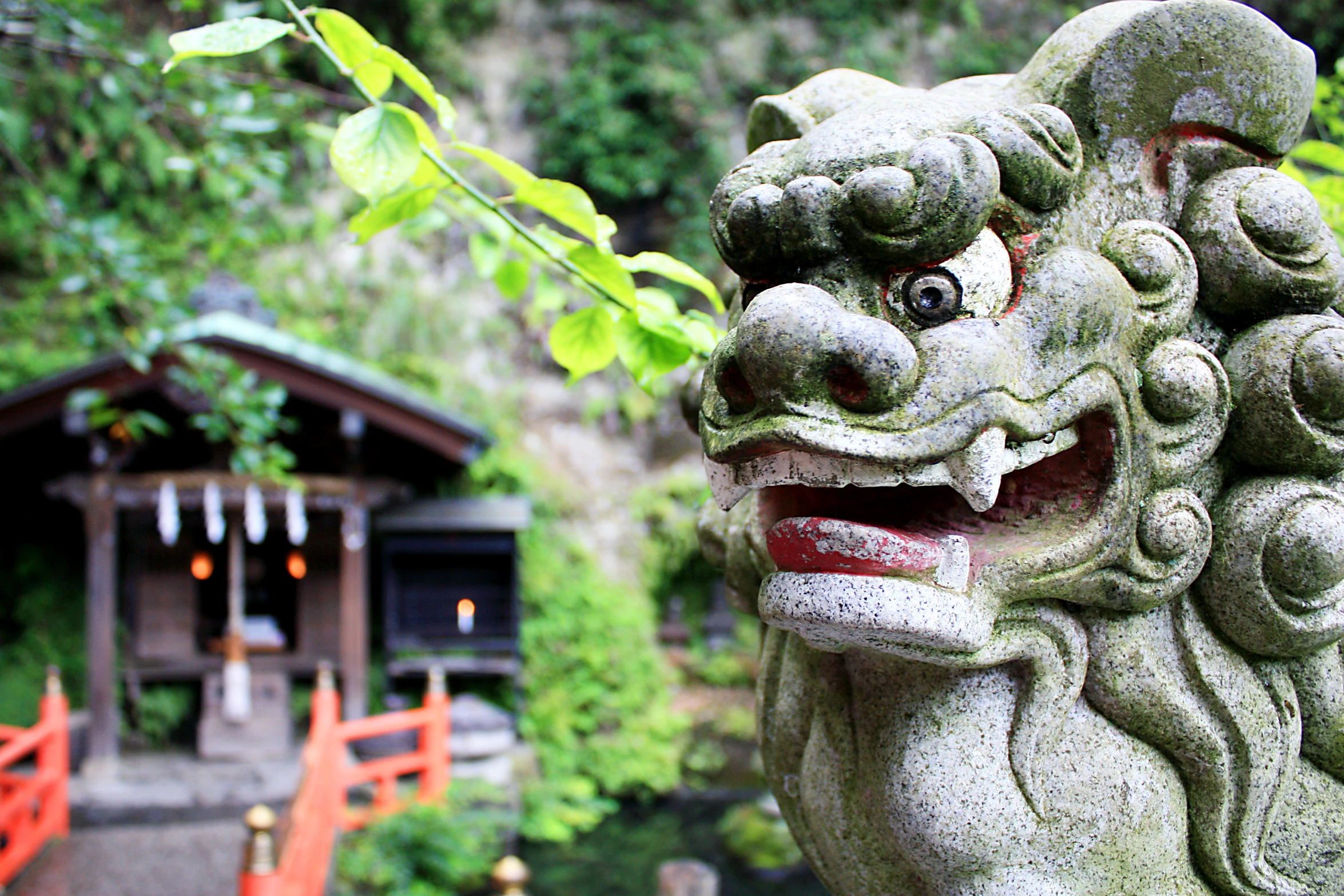 an image of a stone sculpture with its mouth open