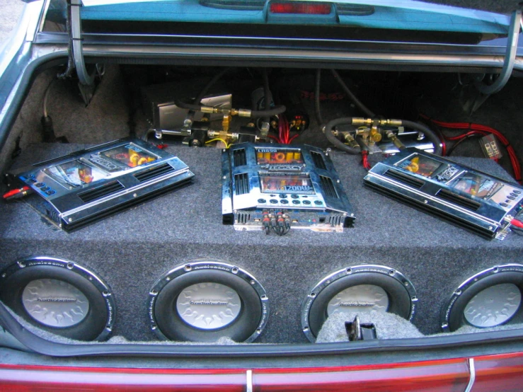 a car trunk with some electronics in it