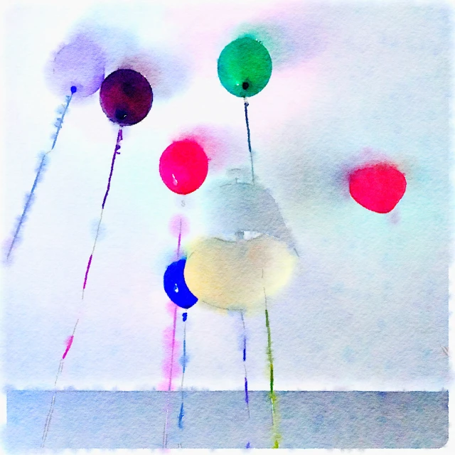 an abstract po of some colorful balloons and streamers