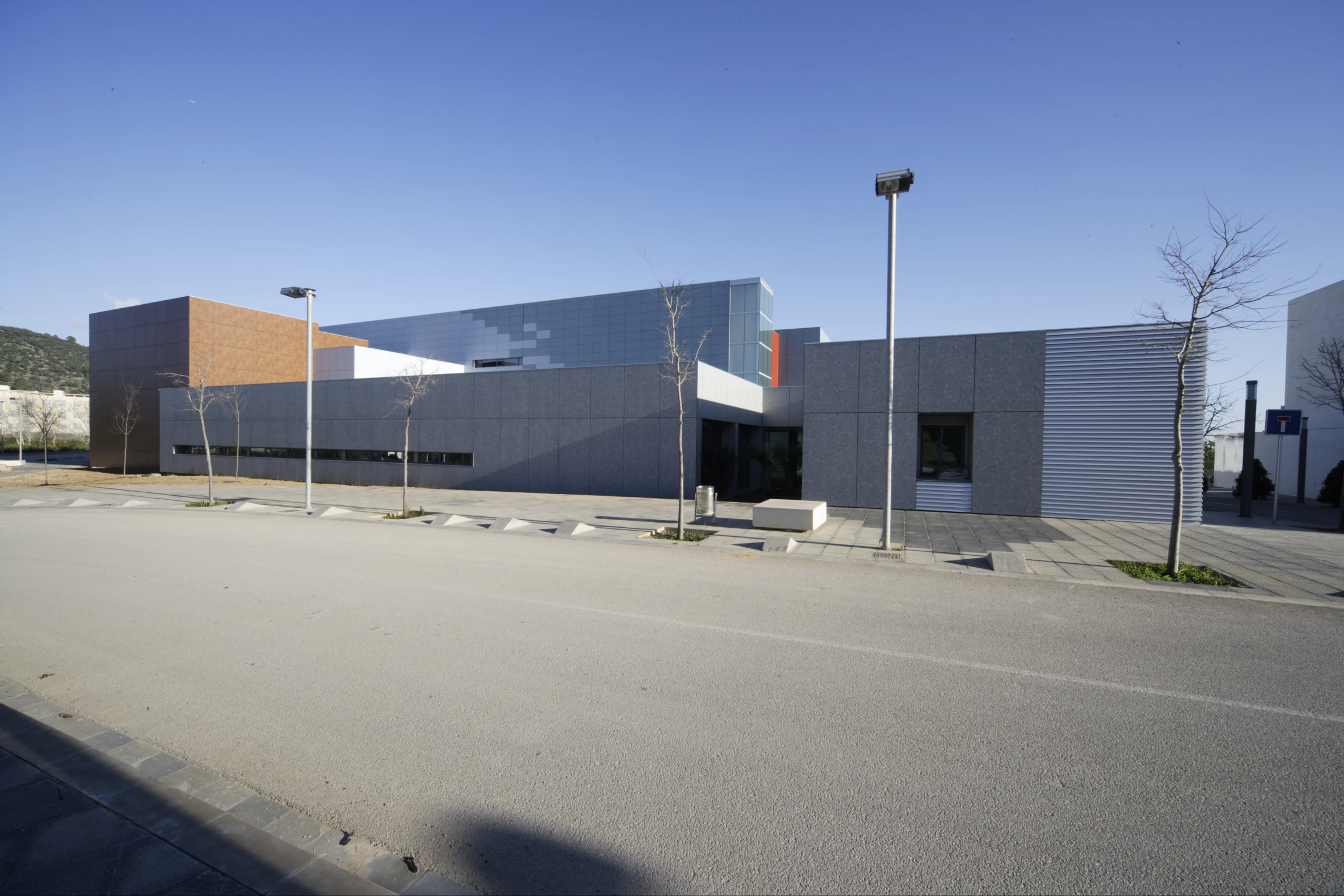 a parking lot is located outside a building