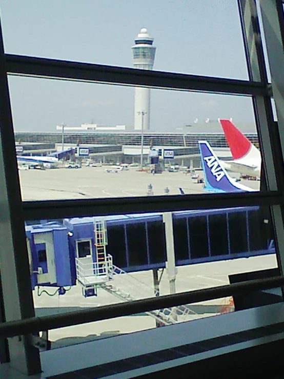 a view of the airport from a train window