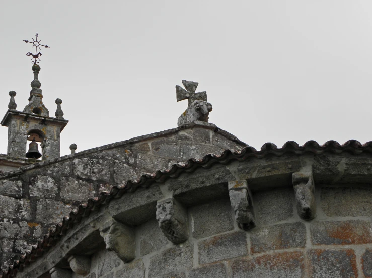 two bell towers on a church with stone structures
