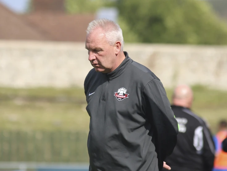 a man with white hair on the field