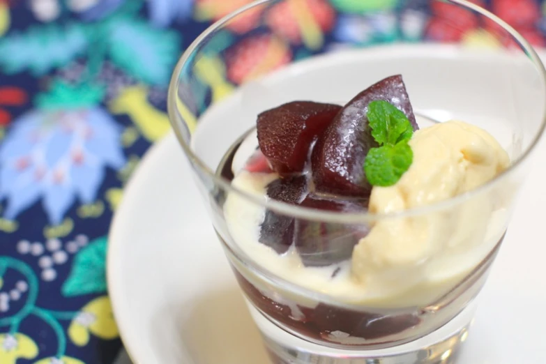 a dessert that includes strawberries in small glass bowls