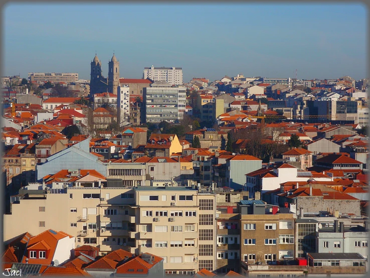 an urban skyline in a city with brown roofs