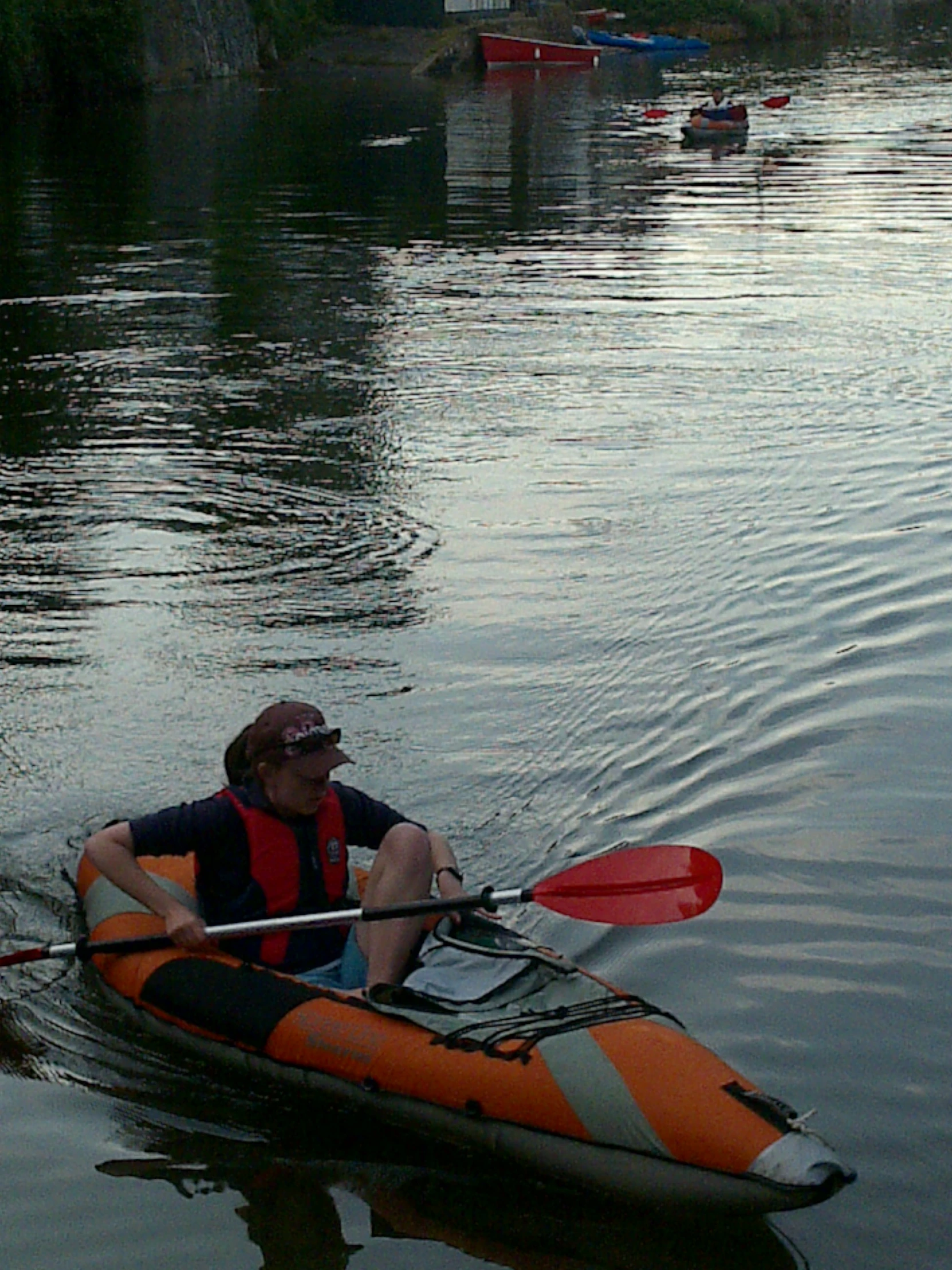 a man that is floating on the water in a kayak