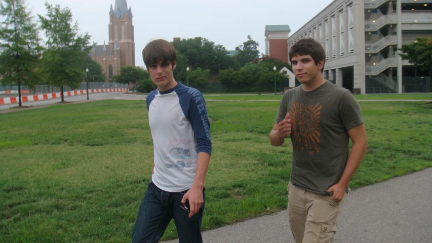 two young men who are walking along side each other