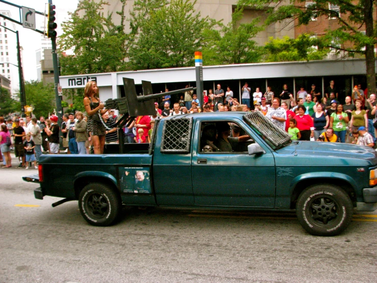 people are in the back of a truck during a parade