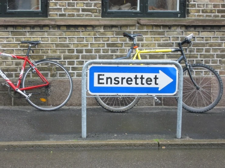 a bicycle that is next to another bike on the street