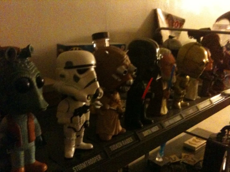 a group of star wars figurines in the shape of darth vader helmets