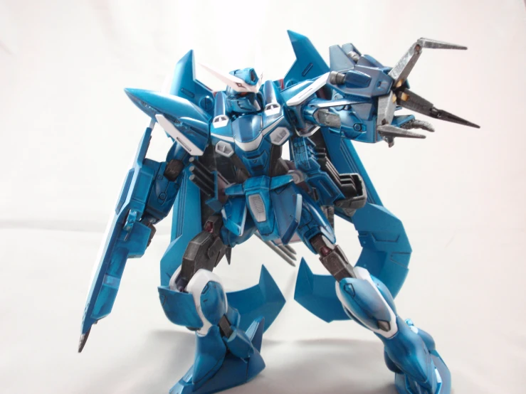 an action figure with a blue paint job