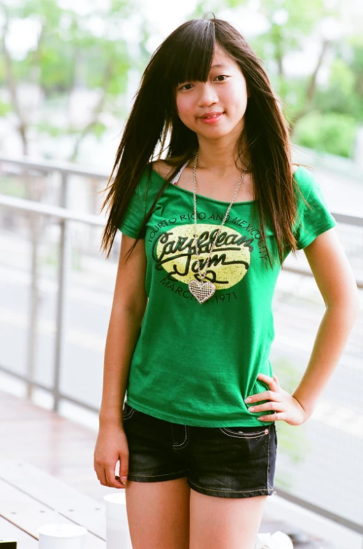 young woman standing on deck with shirt off