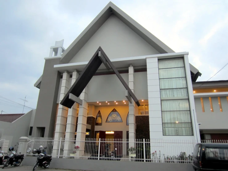 a white and black church with white doors