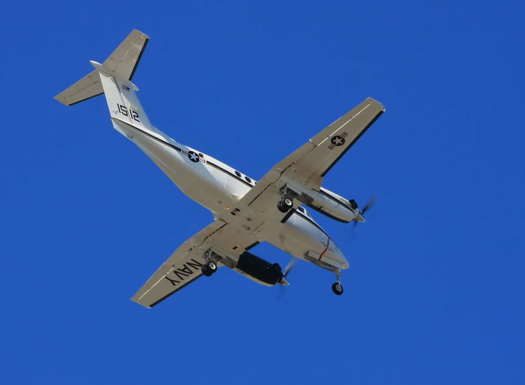 an airplane flying in the blue sky