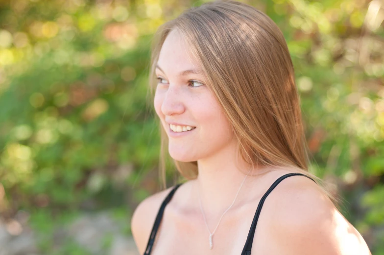 a beautiful young blond lady posing for the camera