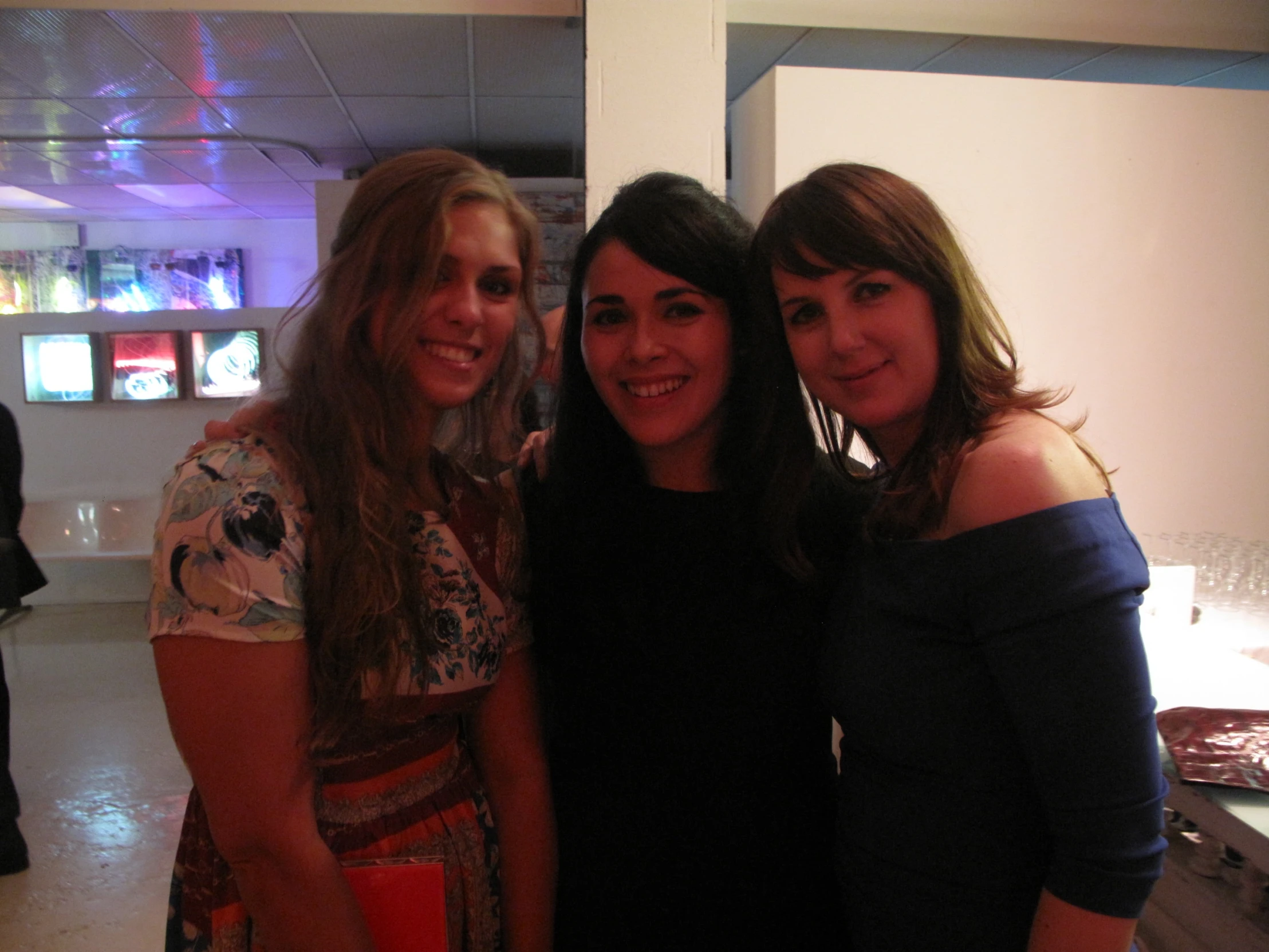 a group of women standing next to each other