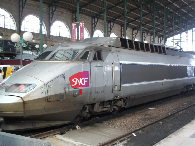 a passenger train sitting at a train station