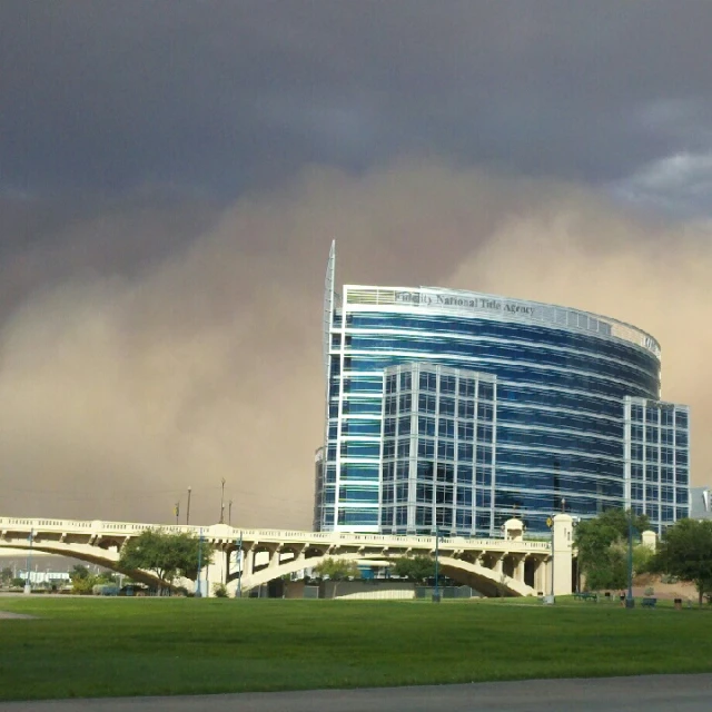 storm clouds roll in over the top of a building