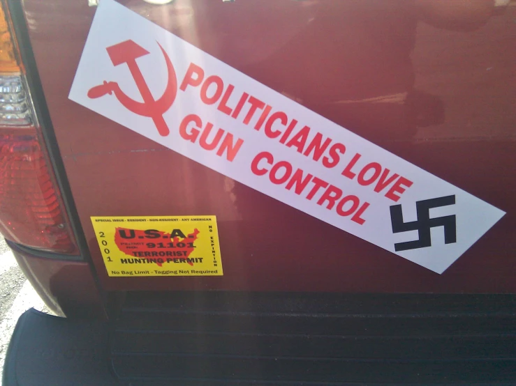 a sticker on a car saying, politicians love gun control