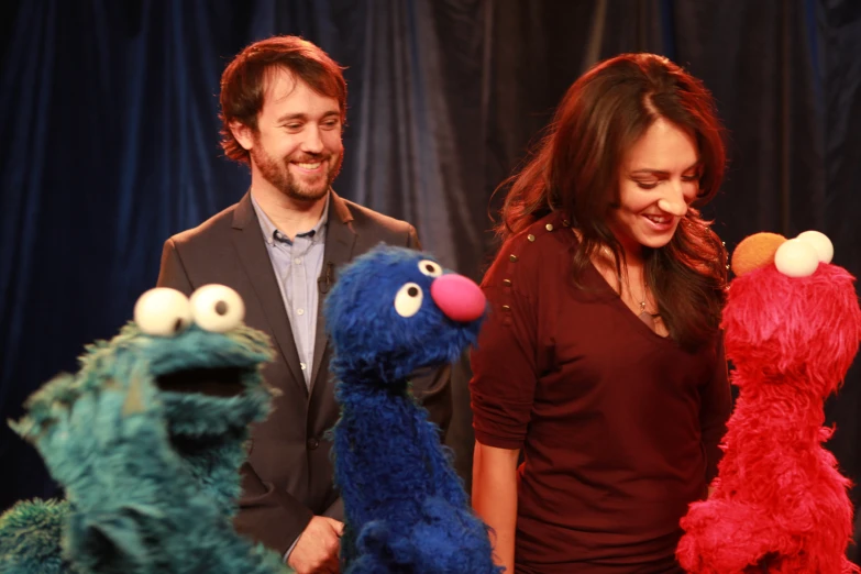 the sesame street actors laugh with an elm street creature
