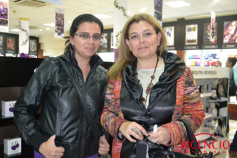 two people in a store holding a phone