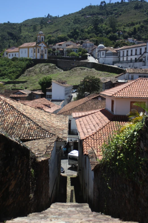 a view of rooftops on top of houses in the area