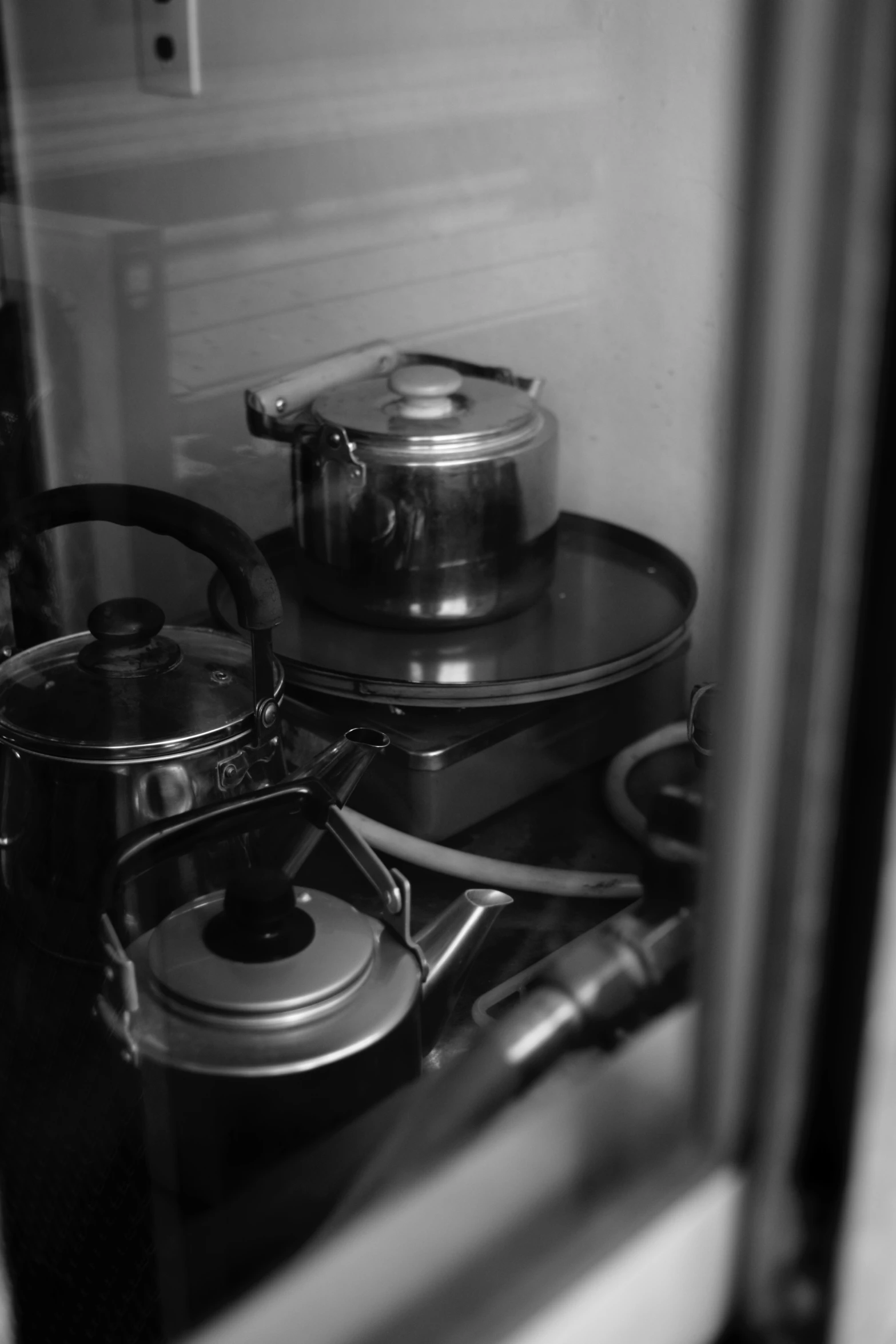 pots and pans sitting on a stove top next to each other
