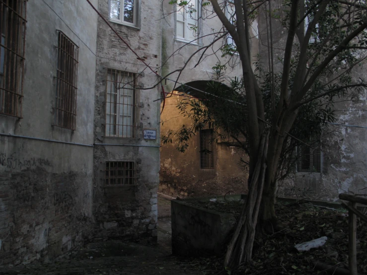 a narrow alleyway in an old stone building