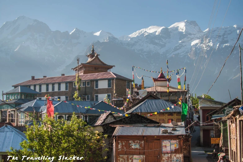 a view of a town and mountains from its roofs