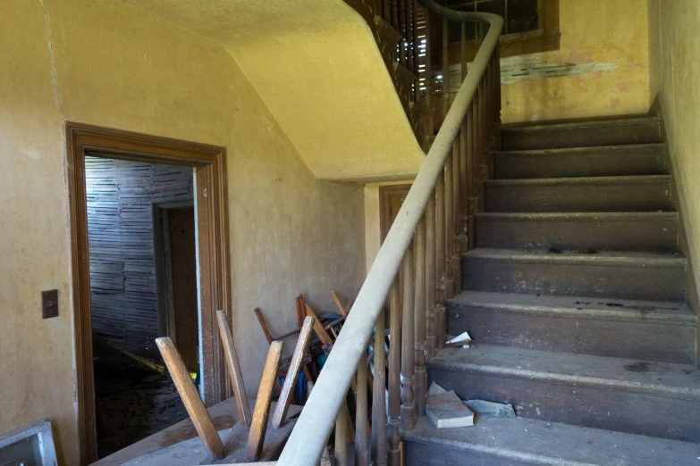 a staircase and staircase in an abandoned home